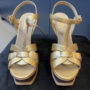YSL Tributes in gold with a special platform design.